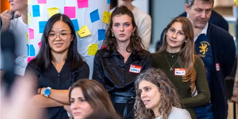 Students of Tomorrow University at a live discussion during a Meetup in Vienna.