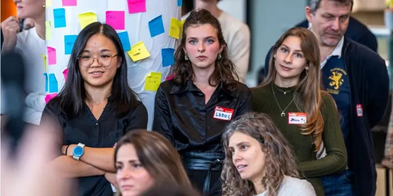 Students of Tomorrow University at a live discussion during a Meetup in Vienna.