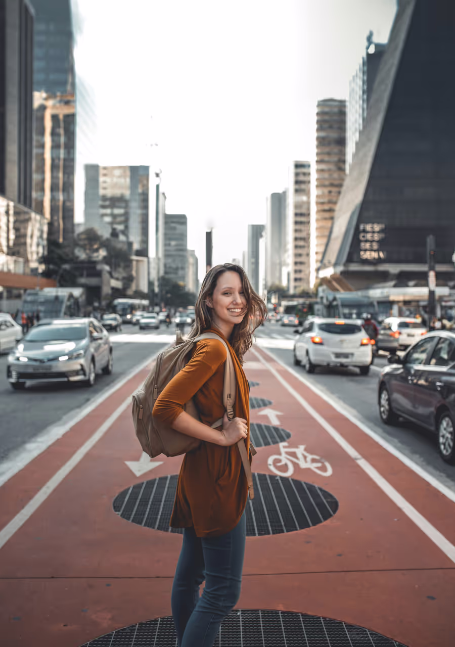 Woman standing on middle of road.