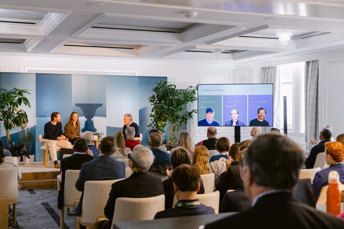 Audience seated at an investor meeting presentation