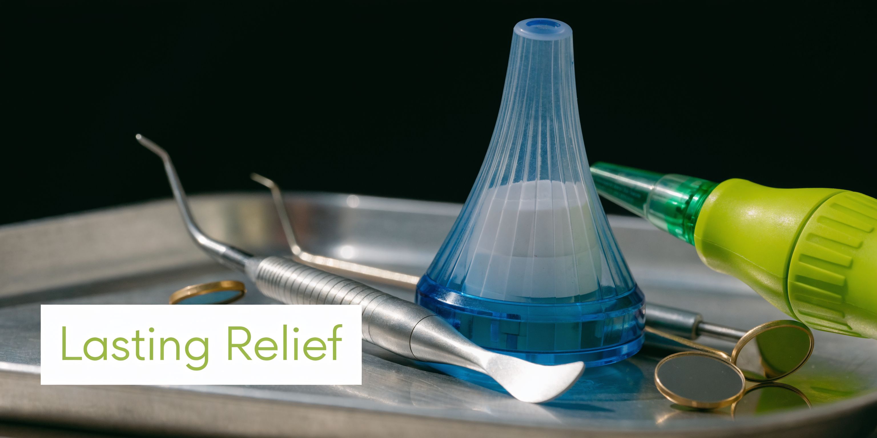 A tray of dental tools including a mirror, explorer, and a blue medicine applicator for dental treatment.