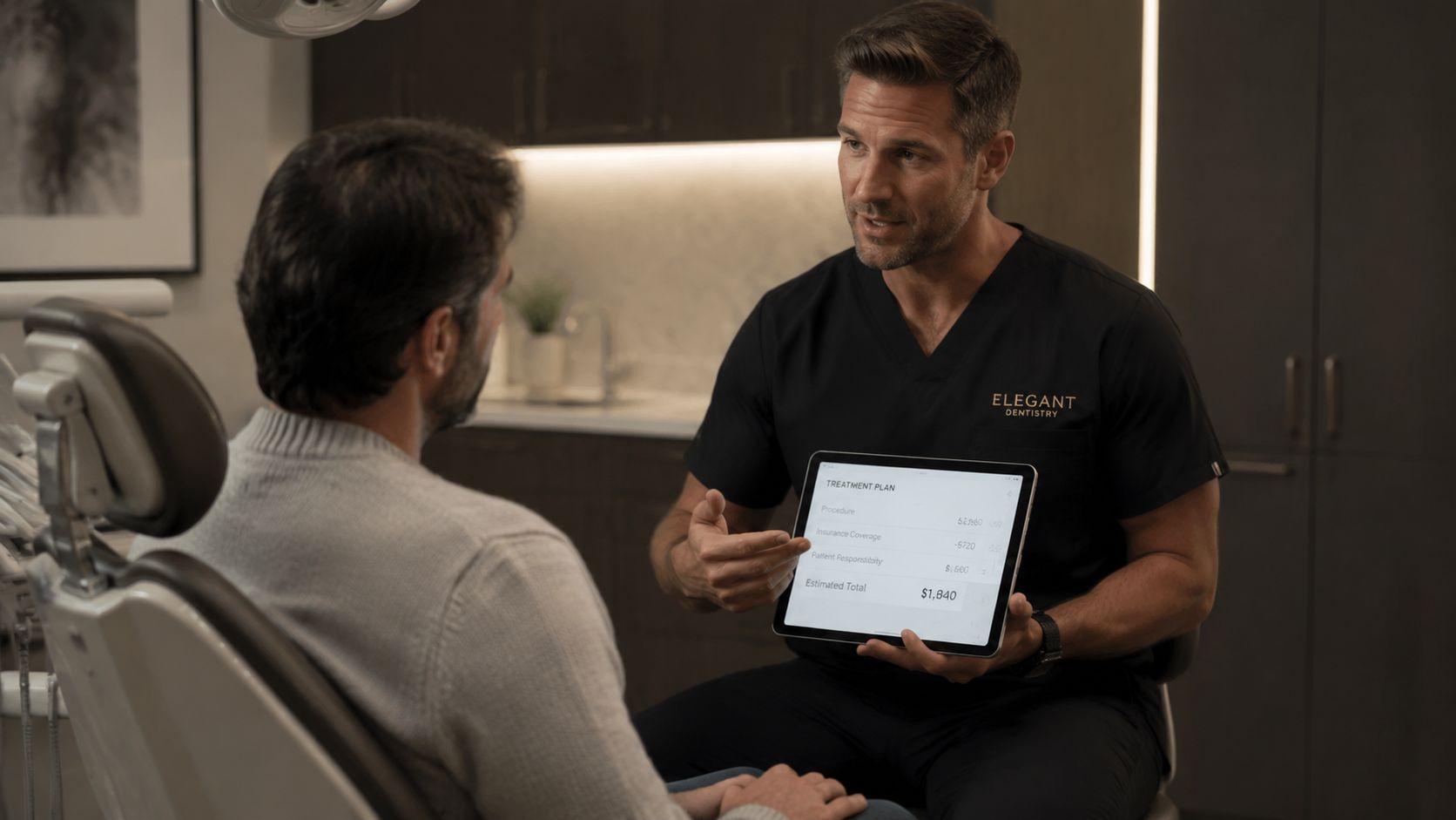 A dentist shows a treatment plan on a tablet to a patient during a consultation appointment.