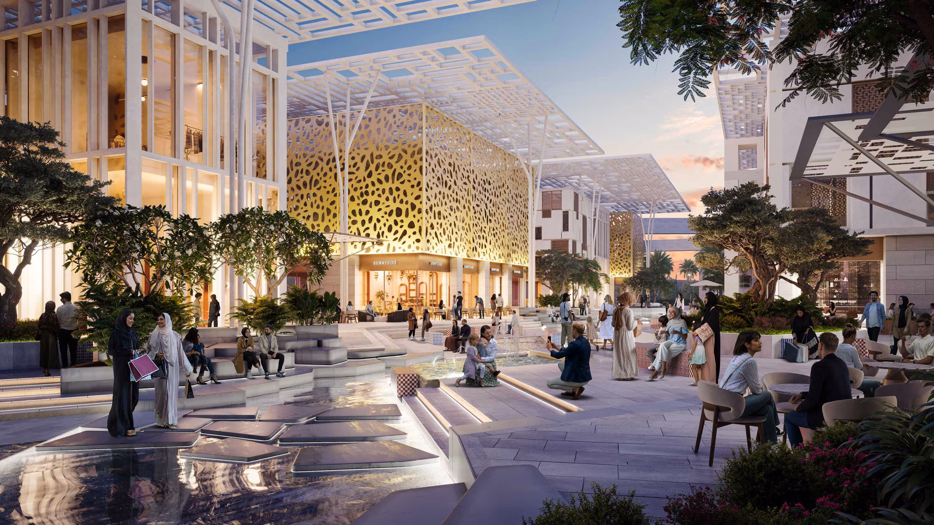 Modern multi-story building with glass balconies and greenery, waterfront promenade with people walking and palm trees.