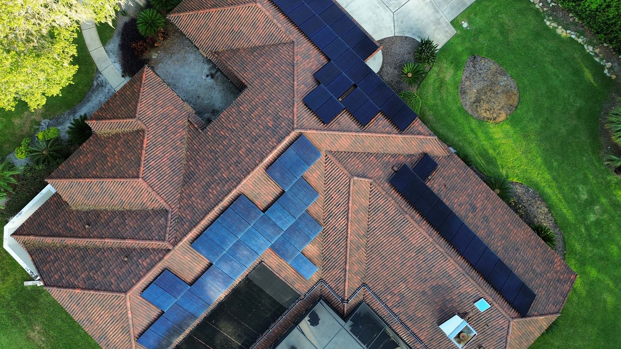 a luxury home with solar panels installed
