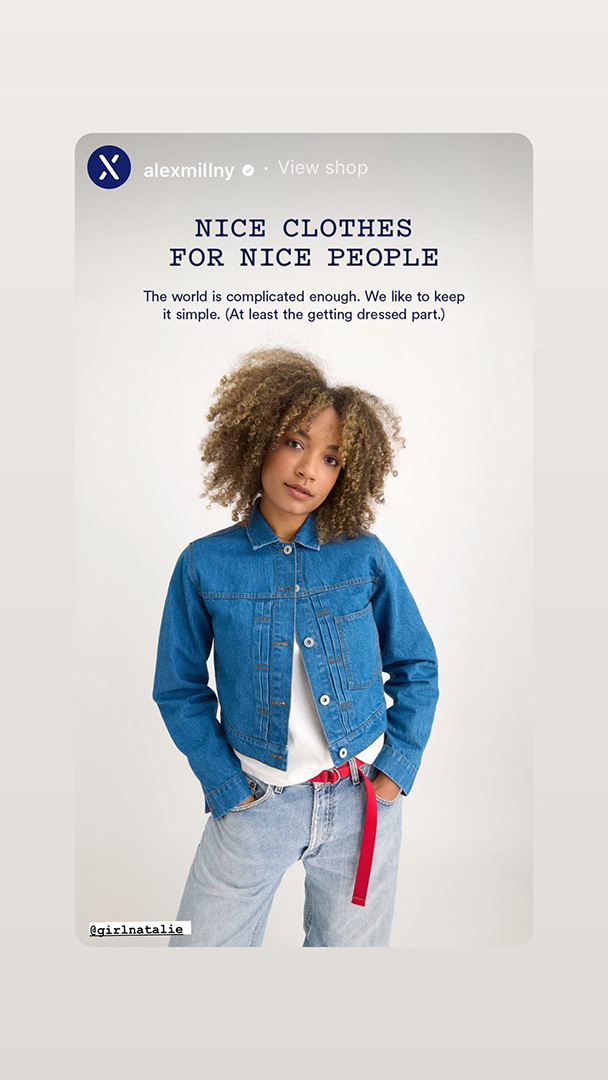 An Instagram story from Alex Mill featuring Natalie Wright wearing a denim jacket and jeans with a red belt. The text reads: “NICE CLOTHES FOR NICE PEOPLE. The world is complicated enough. We like to keep it simple. (At least the getting dressed part.)” with a tag for @girlatnatalie. She poses casually against a white background, embodying a relaxed and effortless style.