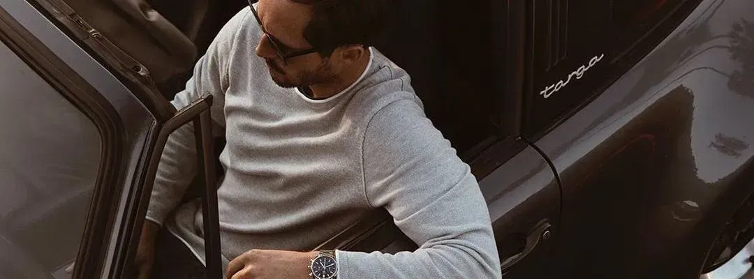 Guy driving a car with the roof down