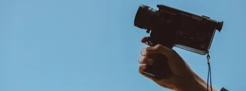 hand holding film camera