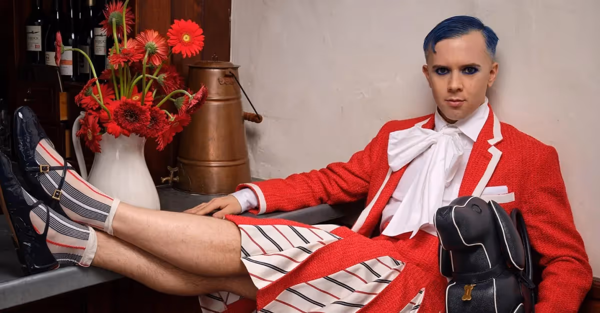 model wearing designer vinyl leather overalls