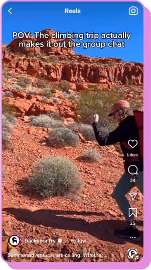 person climbing up rocky terrain