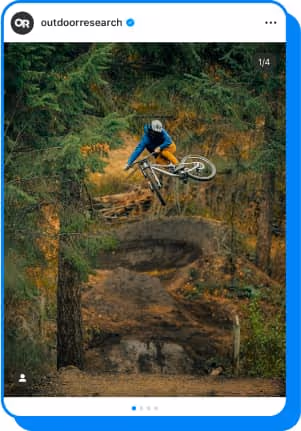 person mountain biking in forest