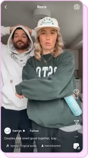 guy and girl wearing sweaters make an instagram reel