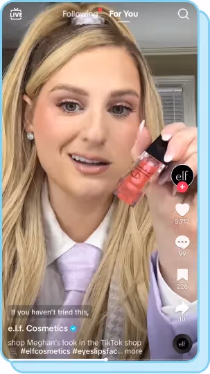 meghan trainor holding up elf lip oil