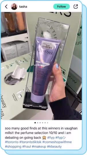 hand holding purple kerastase bottle in marshalls