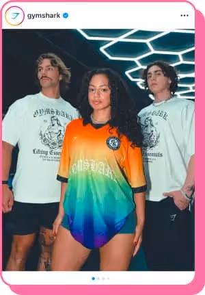 woman wearing multi colored jersey with guys standing behind in gymshark t shirts