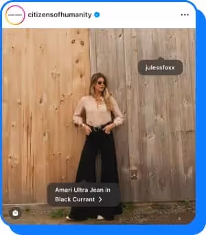 woman wearing wide citizens of humanity jeans with product tags isible