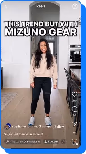 woman doing tiktok dance wearing mizuno sneakers in kitchen