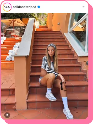 girl wearing black and white striped rash guard from solid and striped