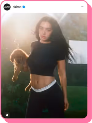 charli xcx for skims holding a puppy