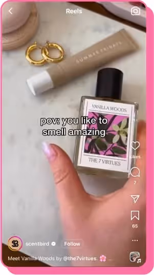 hand reaching for vanilla woods 7 virtues perfume on dresser