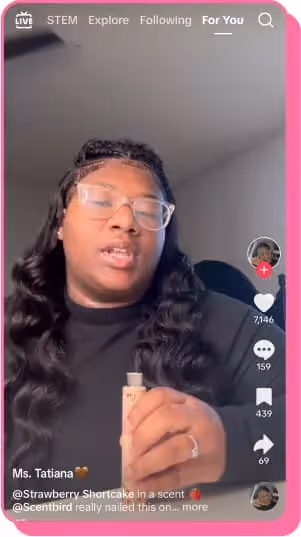 tatiana clark girl in black sweater holding makeup product