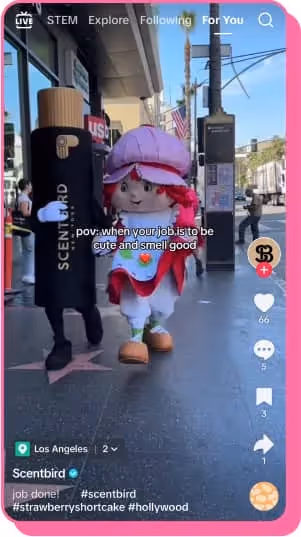 tiktok screenshot of strawberry shortcake walking with scentbird mascot