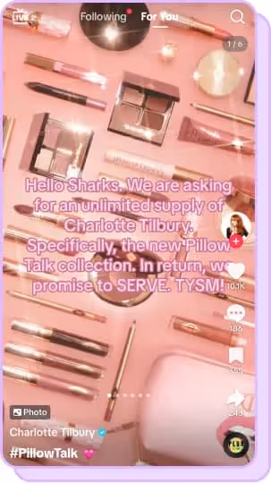 pink flatlay of charlotte tilbury makeup products