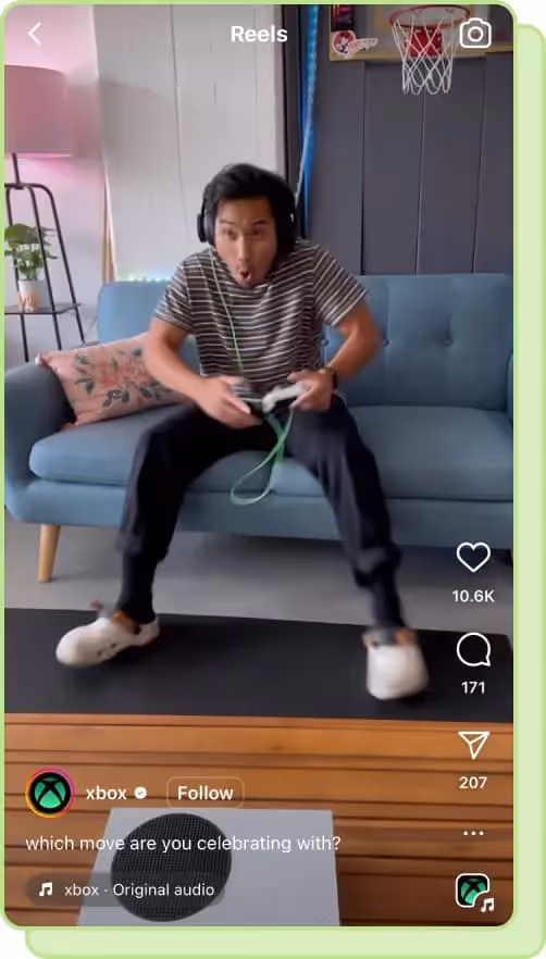 person sitting on couch playing xbox