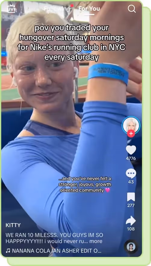 woman wearing blue holding up blue running bracelet