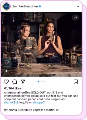 emma chamberlain and kendall jenner standing at bar