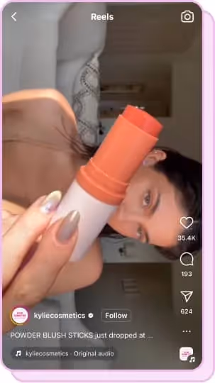 kylie jenner holding up orange blush stick