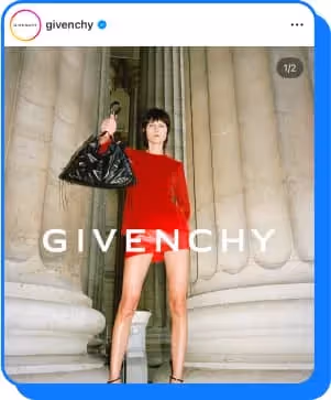 woman wearing red dress holding up leather purse for givenchy