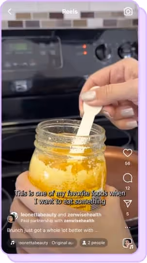 hand scooping ghee butter out of jar for cooking