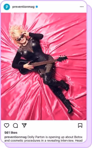 dolly parton lying with guitar on hot pink fabric