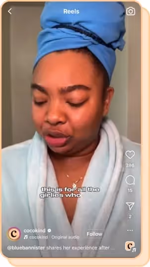 woman wearing robe applying cocokind products 