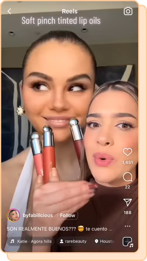 womans face in front of selena gomez holding rare beauty lip oils