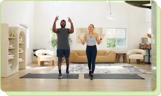 man and woman on yoga mats doing workout tutorial on youtube