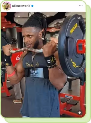 man lifting heavy weight in gym