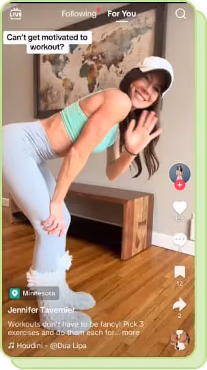 woman waving at camera sharing at home workout