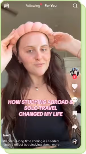 woman putting on puffy headband while filming tiktok