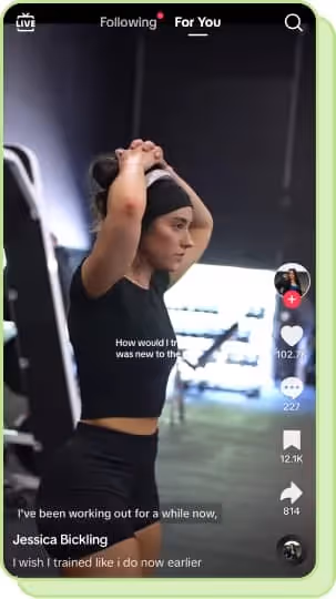 woman with hands on head in gym