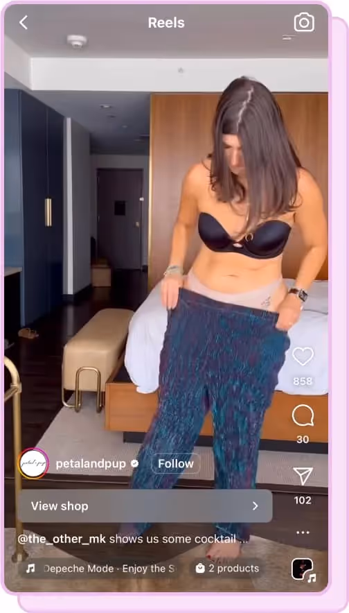 woman tries on clothing from petal and pup ig reels screenshot