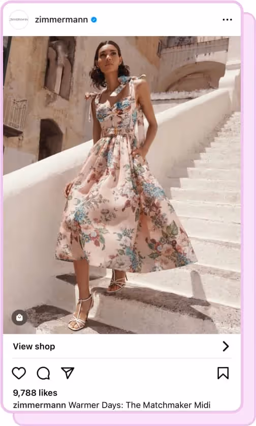 woman walking down stairs wearing zimmermann dress