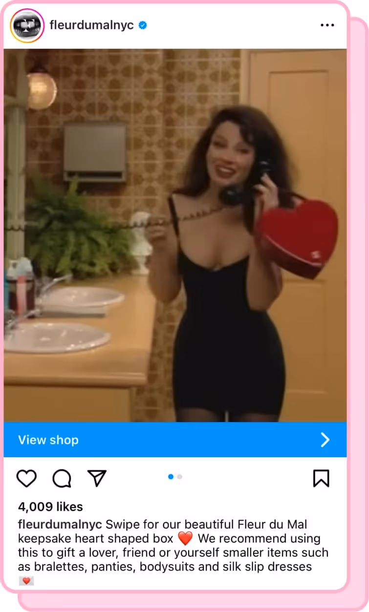 fran fine holding heart shaped purse