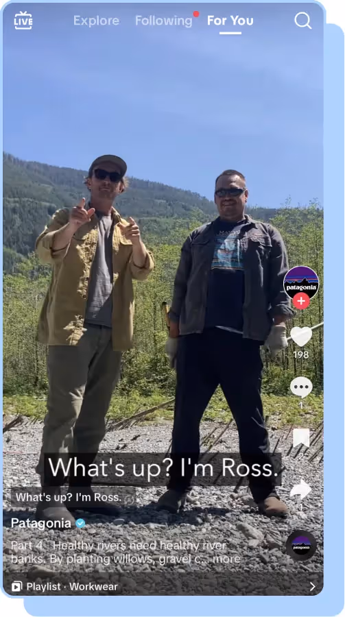 two men stand in forest with green trees in background patagonia tiktok screenshot