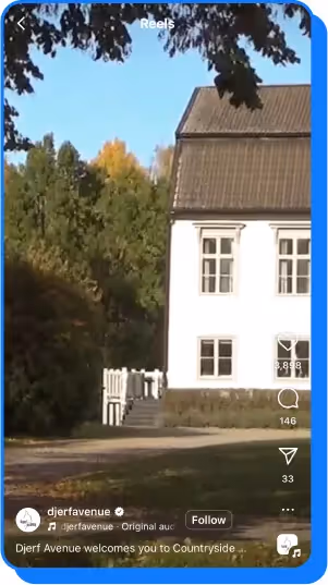 A white countryside house surrounded by trees during autumn with sunlight streaming