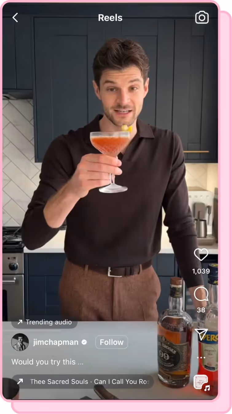 man holding up cocktail 