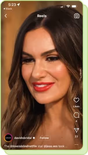 brunette with red lip gloss smiling