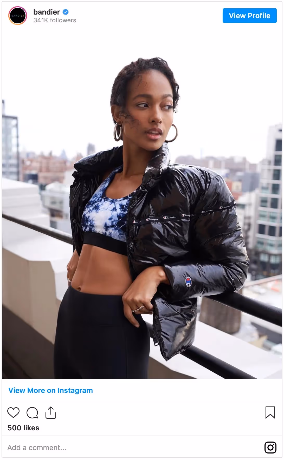 Bandier model on ledge of a building