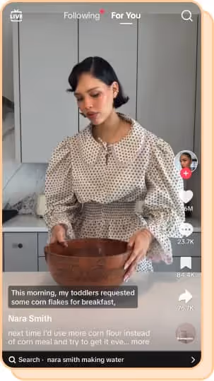 nara smith in polka dot shirt and blouse with wooden bowl