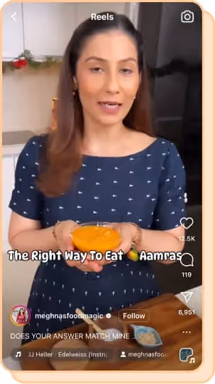 woman in blue shirt holding owl of aamras